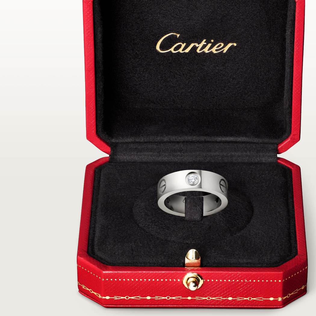 Cartier classic 18K white gold LOVE ring adorned with three diamonds