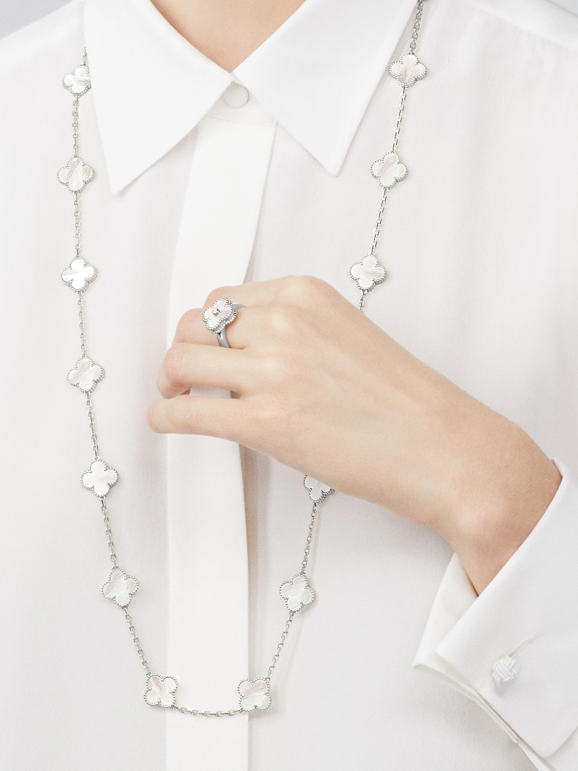 VCA white gold mother-of-pearl ring paired with diamond Vintage Alhambra