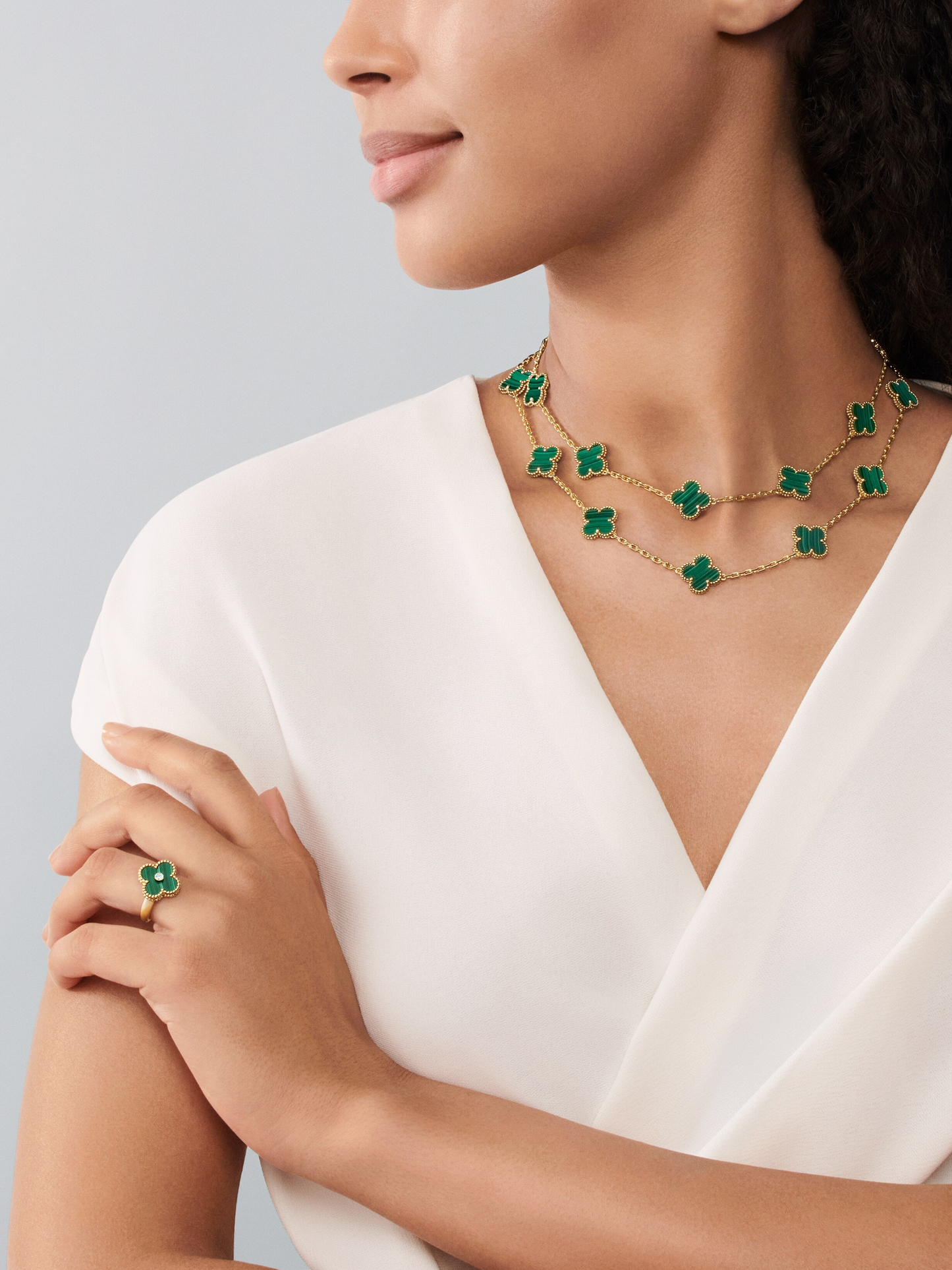 Van Cleef & Arpels gold malachite ring paired with diamond Vintage Alhambra