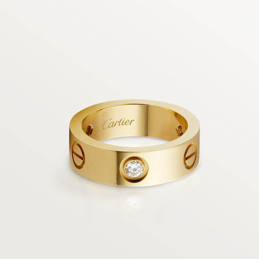 Cartier classic 18K gold LOVE ring adorned with three diamonds