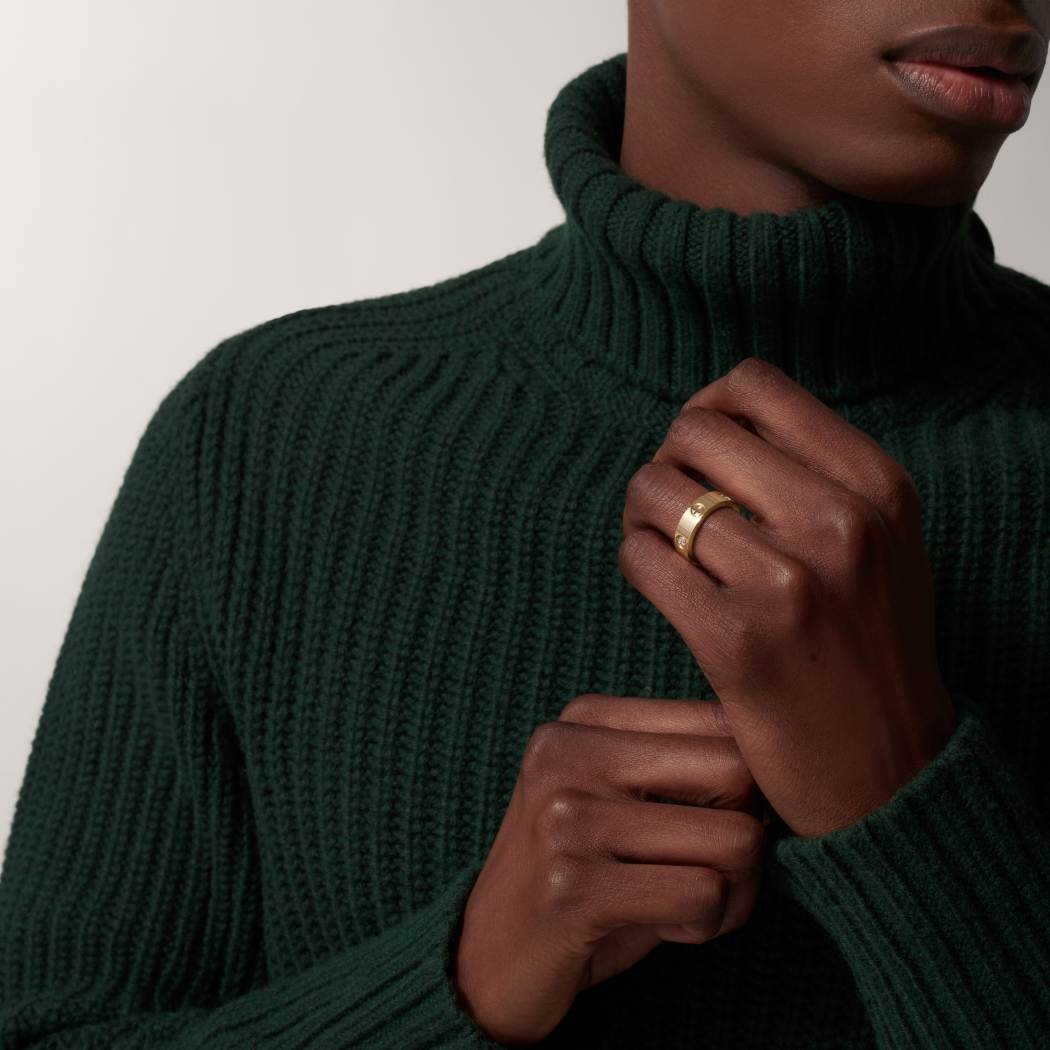 Cartier classic 18K gold LOVE ring adorned with three diamonds