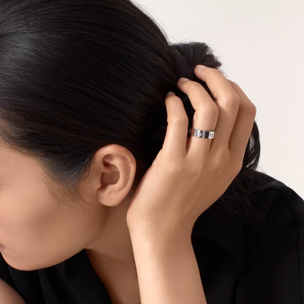 Cartier classic 18K white gold LOVE ring adorned with three diamonds