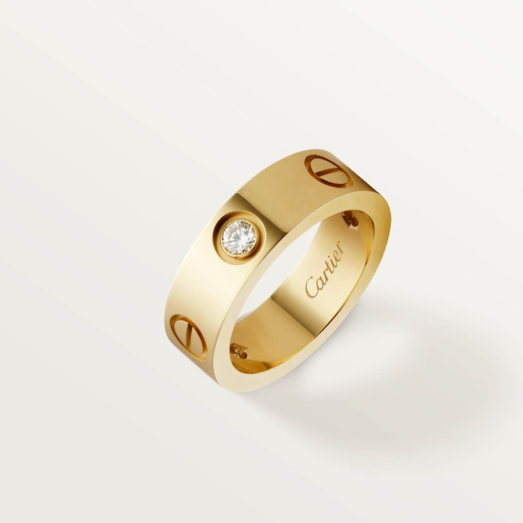 Cartier classic 18K gold LOVE ring adorned with three diamonds