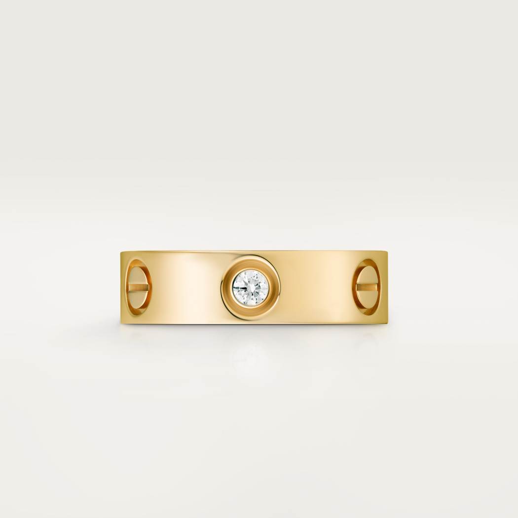 Cartier classic 18K gold LOVE ring adorned with three diamonds