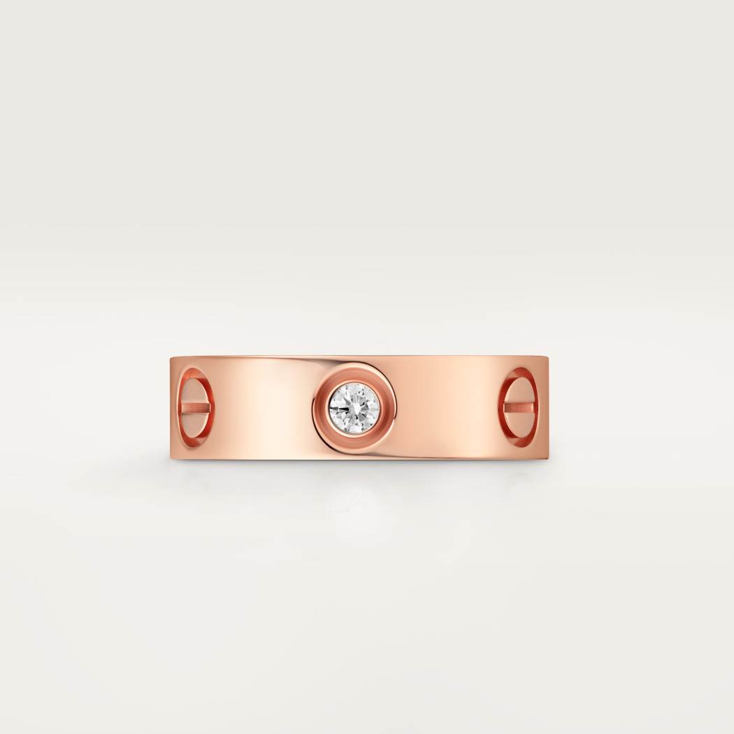 Cartier classic 18K rose gold LOVE ring adorned with three diamonds