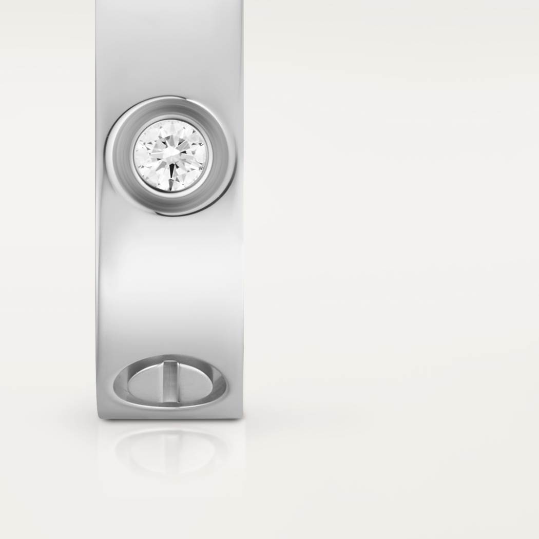 Cartier classic 18K white gold LOVE ring adorned with three diamonds