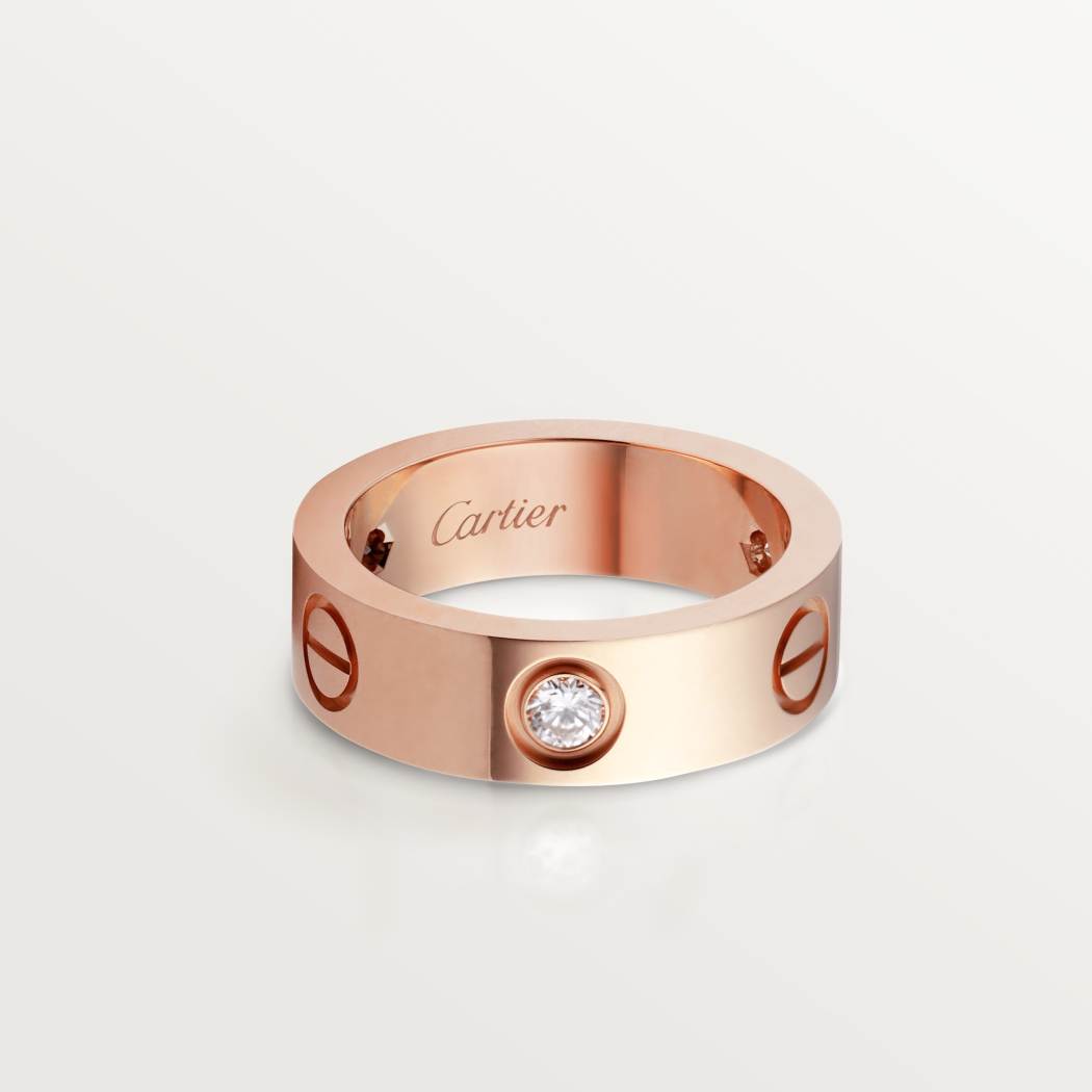 Cartier classic 18K rose gold LOVE ring adorned with three diamonds
