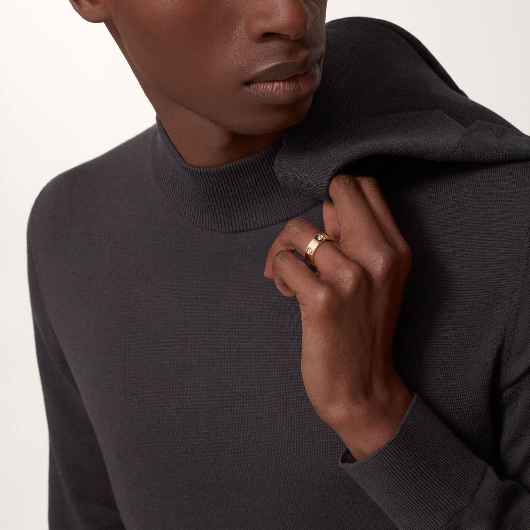 Cartier classic 18K rose gold LOVE ring adorned with six diamonds