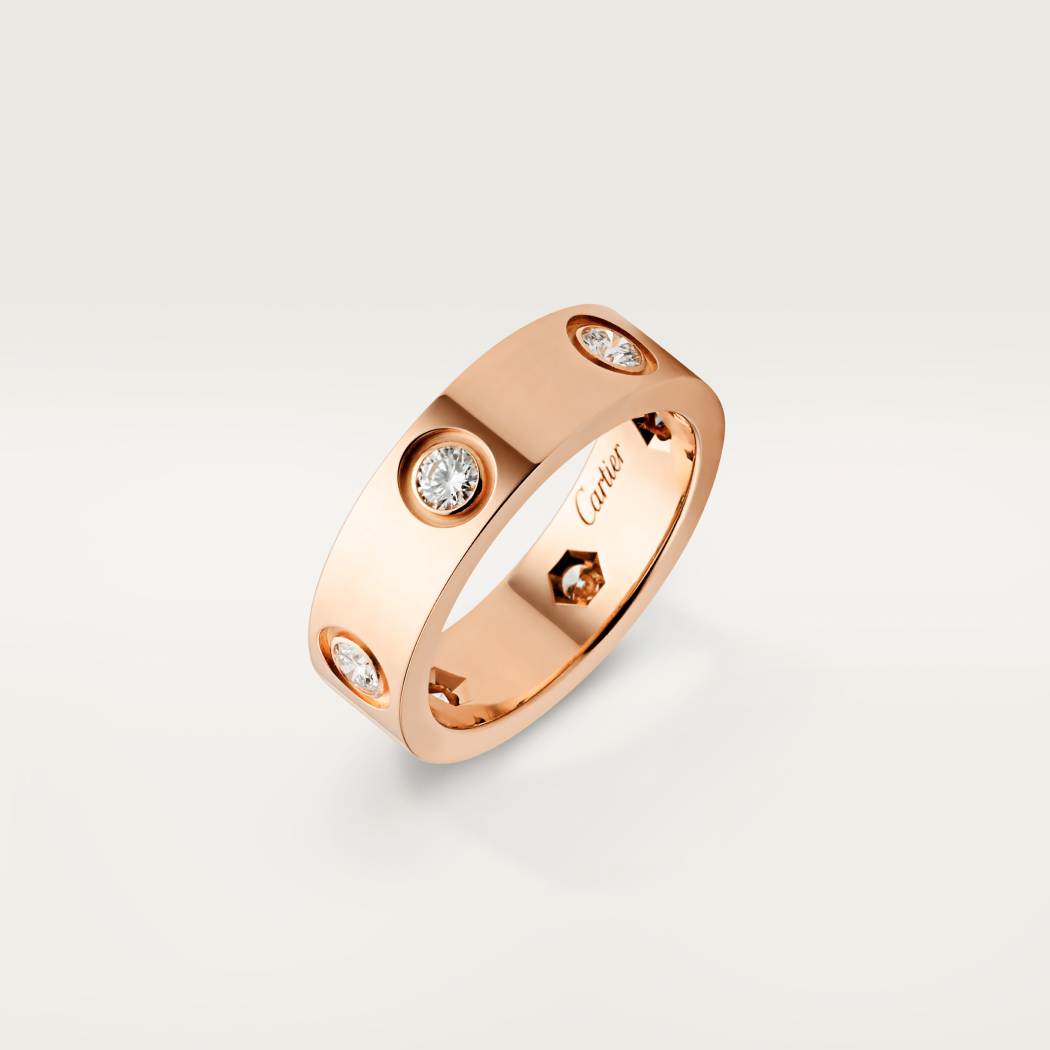 Cartier classic 18K rose gold LOVE ring adorned with six diamonds