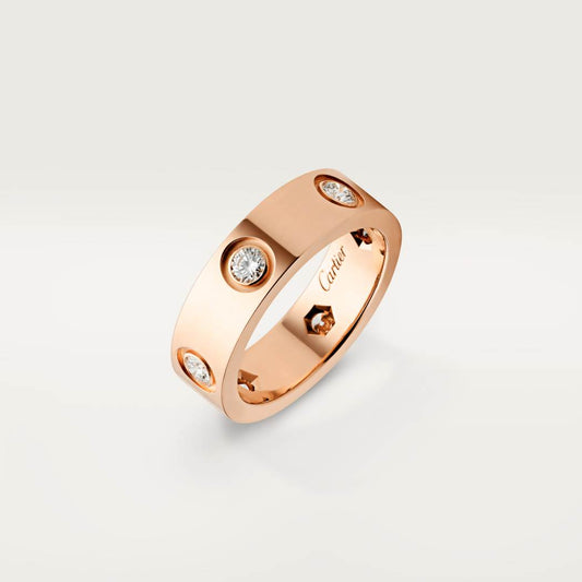 Cartier classic 18K rose gold LOVE ring adorned with six diamonds