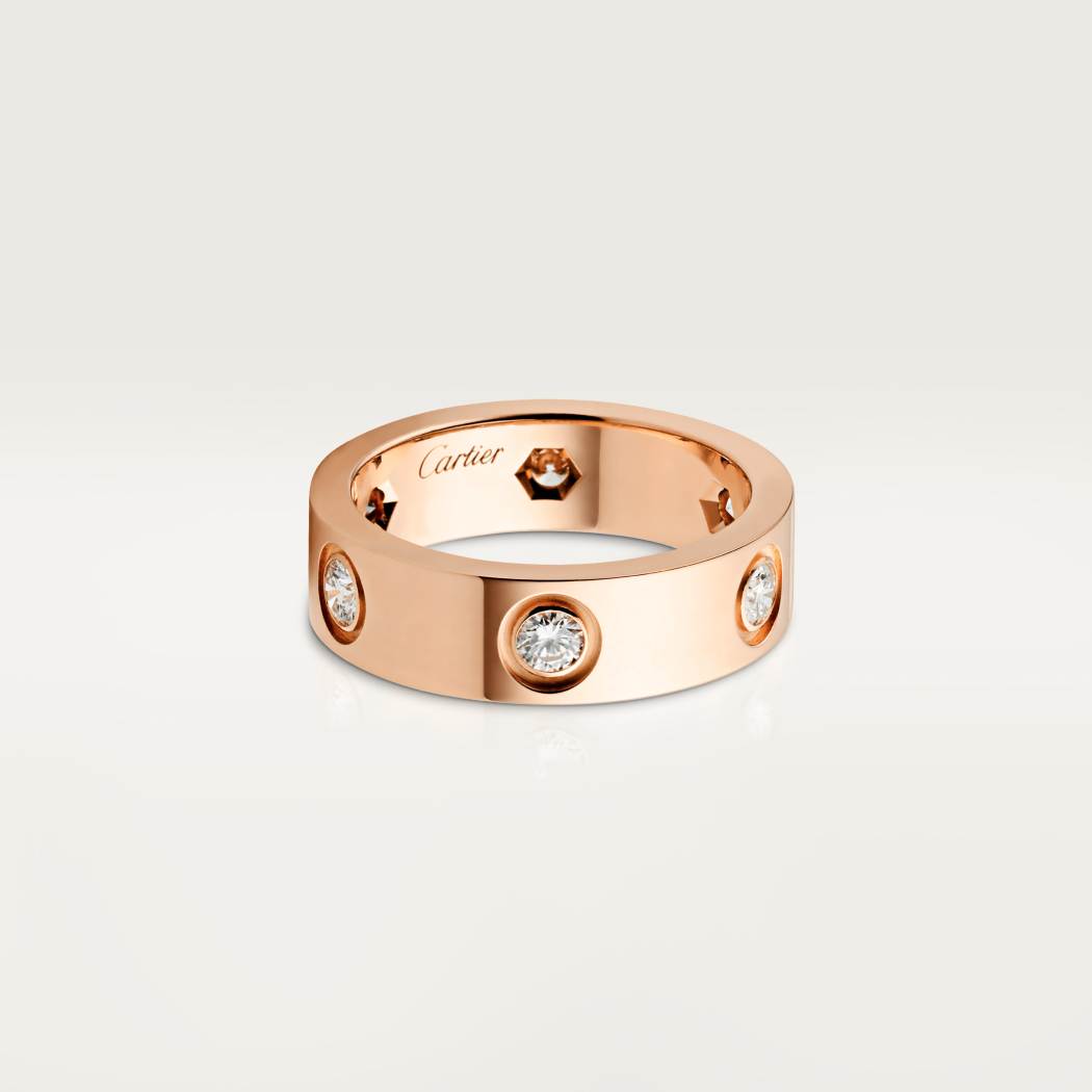 Cartier classic 18K rose gold LOVE ring adorned with six diamonds