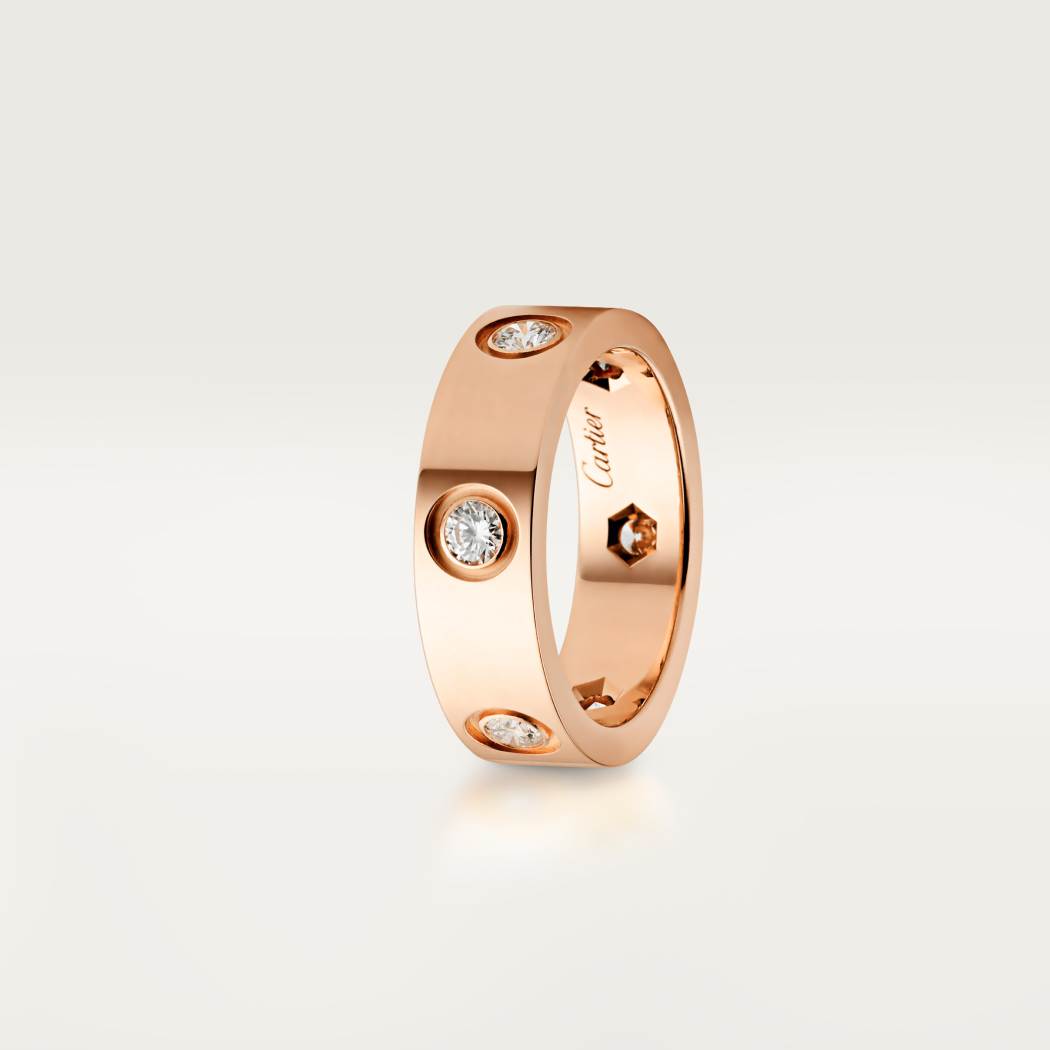Cartier classic 18K rose gold LOVE ring adorned with six diamonds