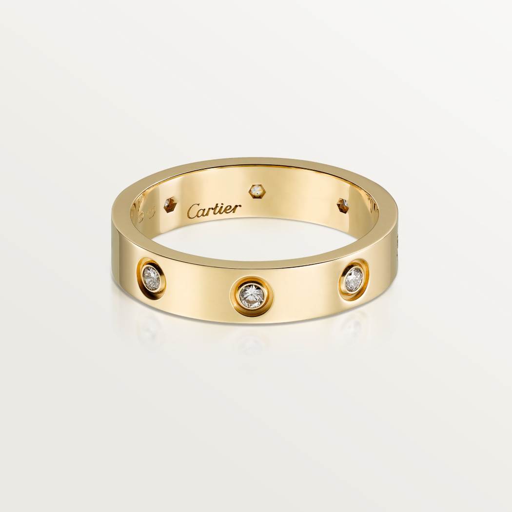 Cartier classic 18K gold LOVE ring adorned with eight diamonds