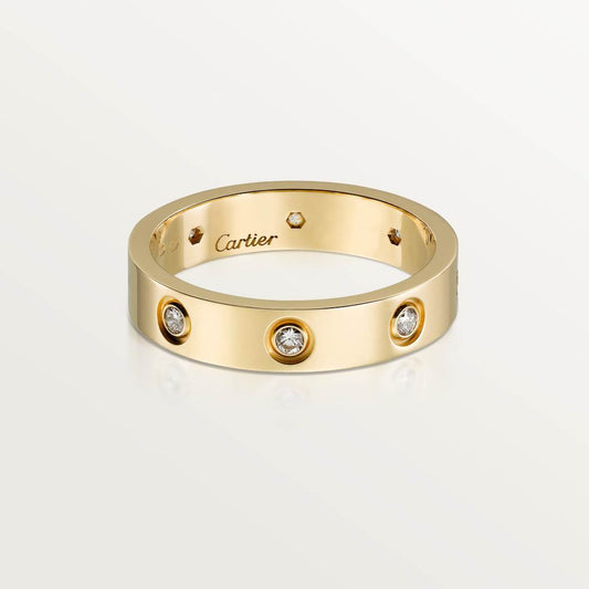 Cartier classic 18K gold LOVE ring adorned with eight diamonds