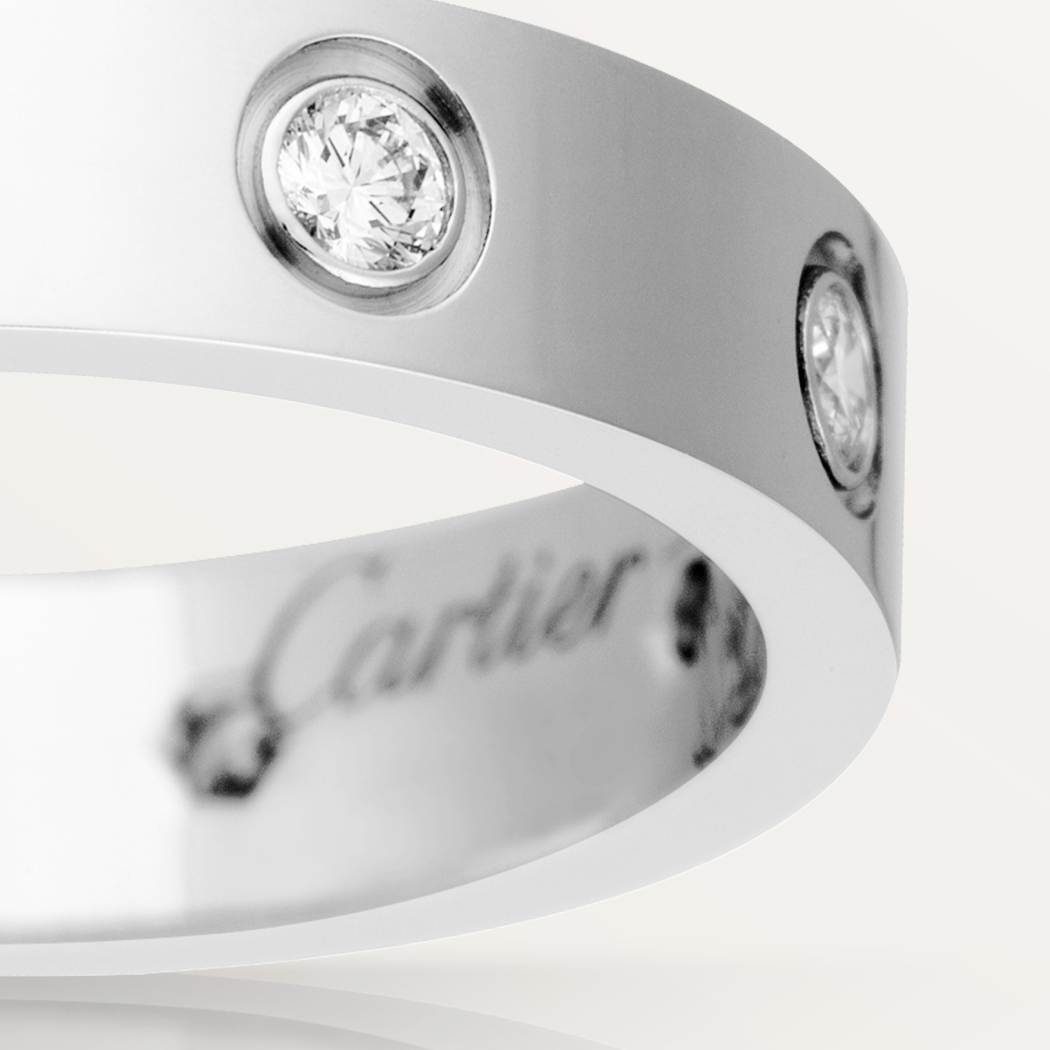 Cartier classic 18K white gold LOVE ring adorned with eight diamonds