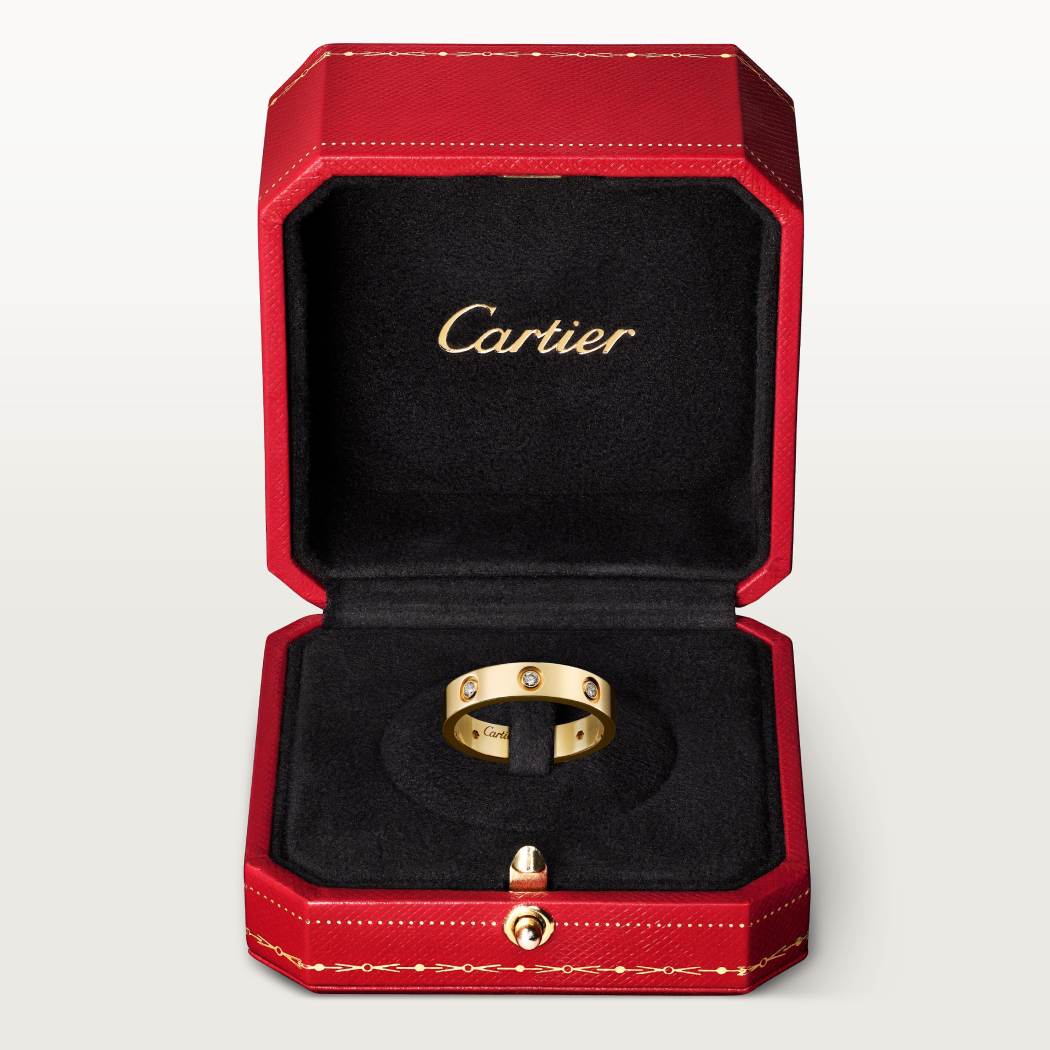 Cartier classic 18K gold LOVE ring adorned with eight diamonds