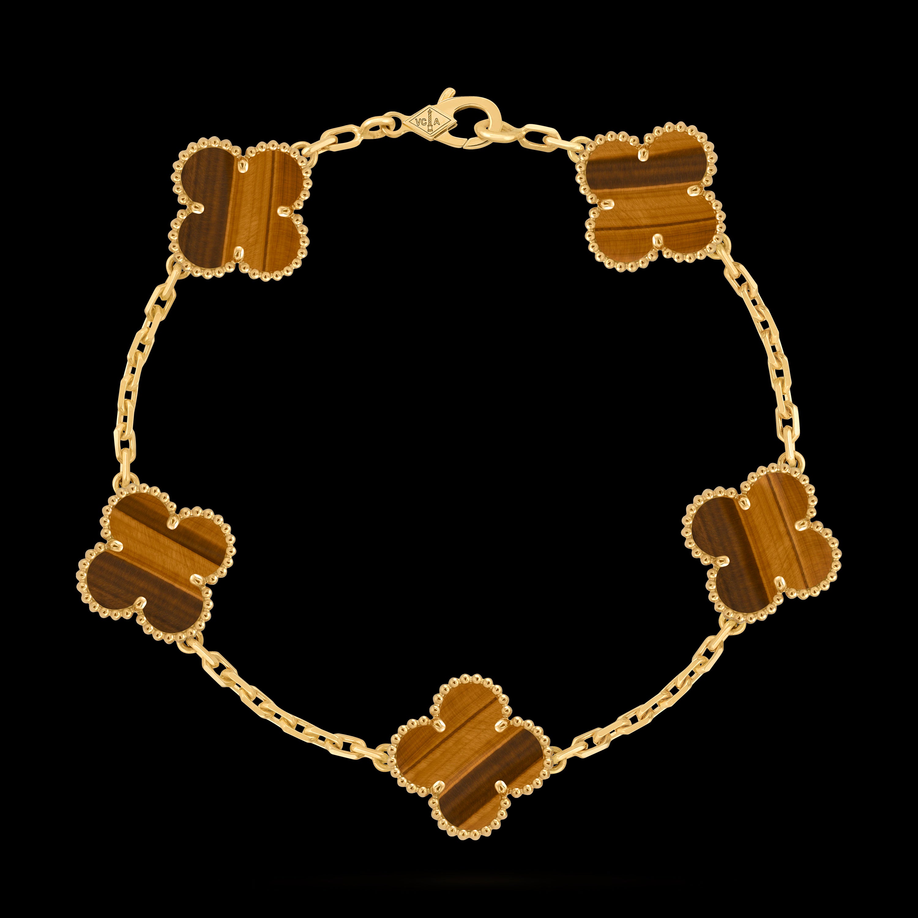 VCA four-leaf clover 5-flower golden bracelet paired with tiger's eye stone